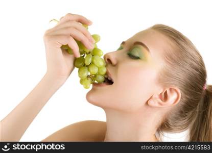 Pretty young woman with grape closeup on the white background