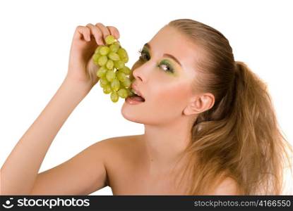 Pretty young woman with grape on the white background