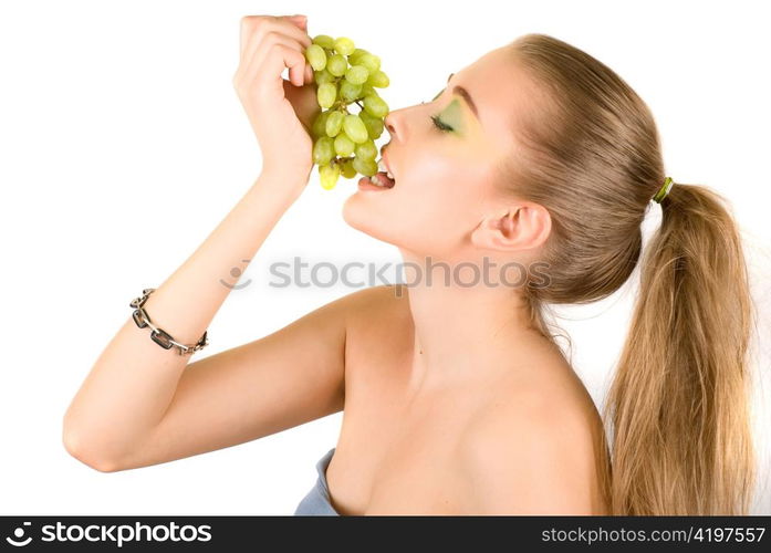 Pretty young woman with grape on the white background