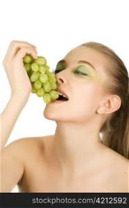Pretty young woman with grape on the white background