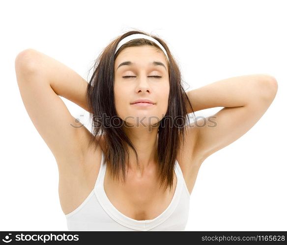 pretty young woman with hands behind head