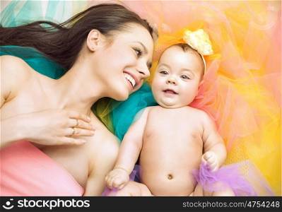 Pretty young woman with her newborn child