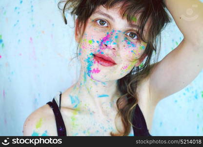 Pretty young woman with paint in her face