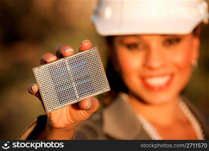 Pretty young woman with small solar panel