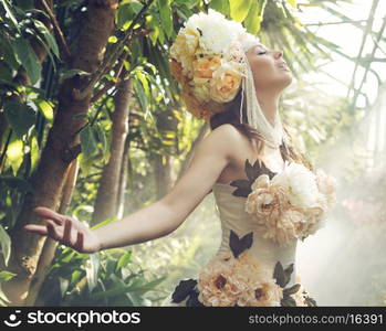 Pretty young woman with the colorful flower hat