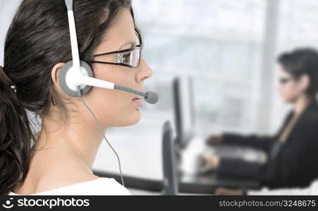 Pretty young woman works as an IT helpdesk operator.