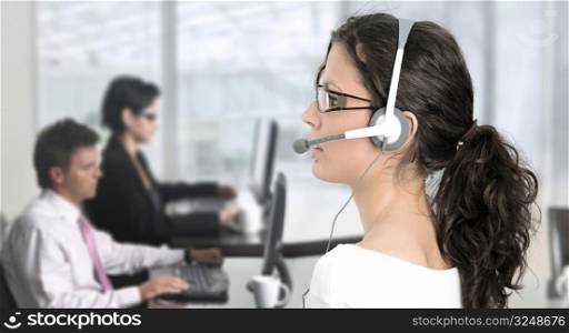 Pretty young woman works as an IT helpdesk operator.