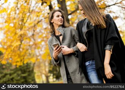 Pretty young women in the autumn park