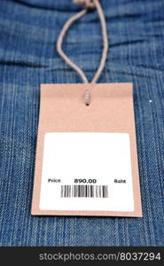 price tag with barcode on jeans textured