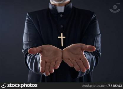 Priest open hands arms praying offering oblation