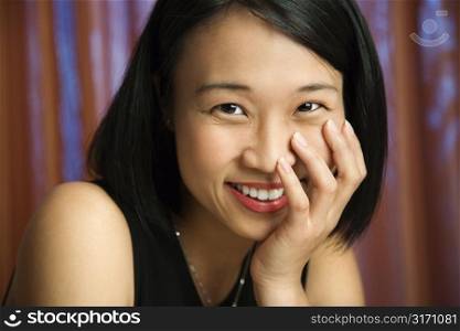 Prime adult Asian female portrait.