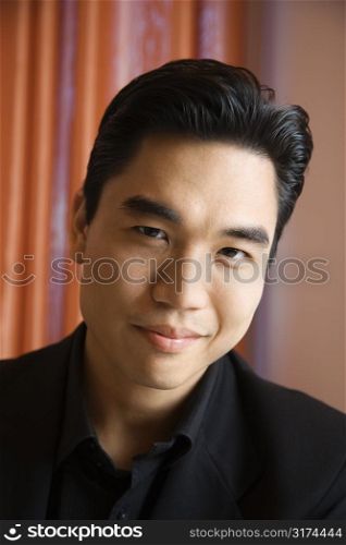 Prime adult Asian male portrait.