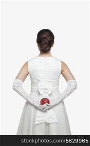 Princess Holding Apple Behind Back