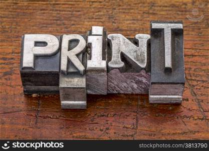 print word in vintage metal type printing blocks over grunge wood