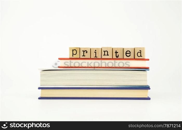 printed word on wood stamps stack on books, knowledge and academic concept