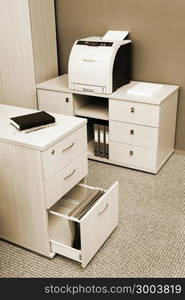 printer from the cabinet in a modern office