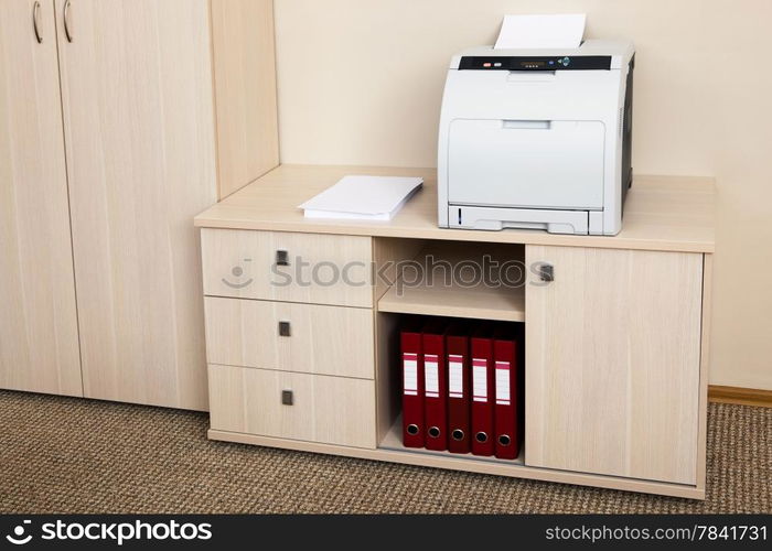 printer from the cabinet in a modern office