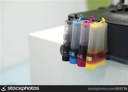 Printer Ink jet tank. Computer and Color concept. Technology accessories and Equipment theme. Office and Workplace theme.