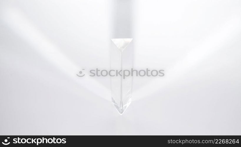 prism dispersing sunlight white background