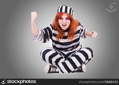 Prisoner in striped uniform on white