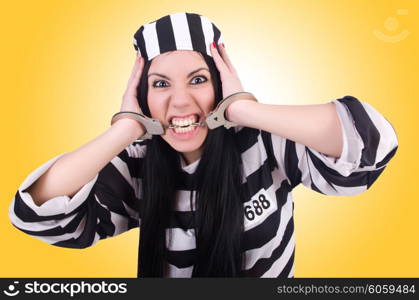 Prisoner in striped uniform on white