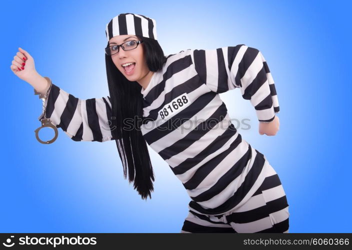 Prisoner in striped uniform on white