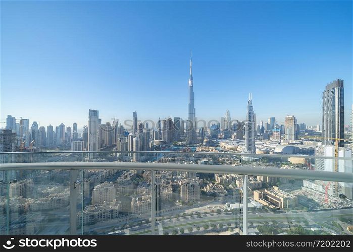 Private balcony or terrace at Burj Khalifa in hotel, Dubai Downtown skyline, United Arab Emirates or UAE. Financial district in smart urban city in travel trip and holidays vacation concept.