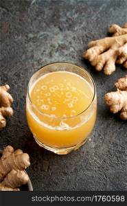 Probiotic drink with ginger in a glass, with copy space