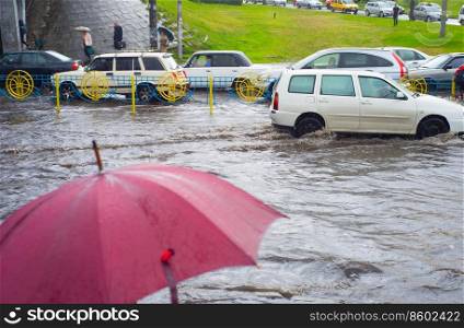 Problem car traffic on a flooded road in the rain. Kiev, Ukraine