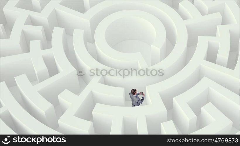 Problem solving concept Mixed media. Confused businessman standing in white maze with cup of coffee in cup