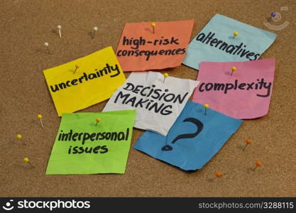 problems in decision making process - uncertainty, alternatives, risk consequences, complexity, personal issues; color notes and pins on cork bulletin board board