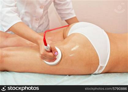procedure. Defocused pronounced background of procedure for women hip against cellulite and fat