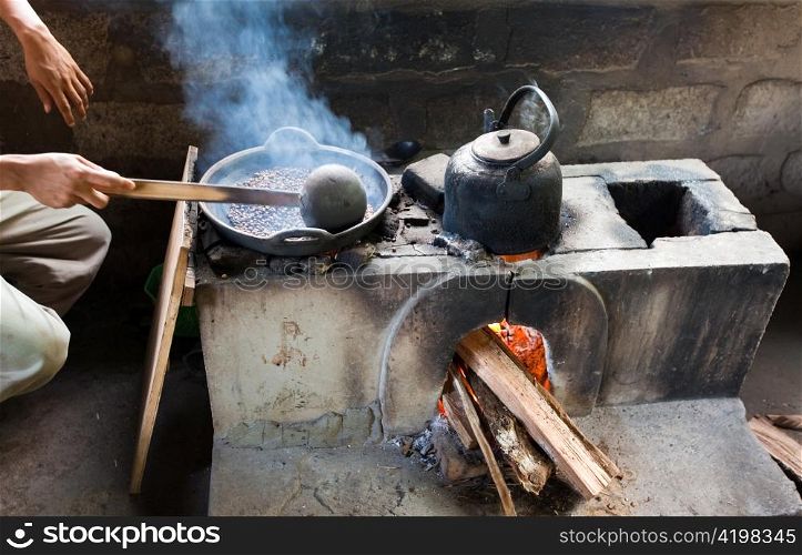 Processing of a crop of coffee. Asia. Frying of coffee grains