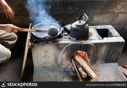Processing of a crop of coffee. Asia. Frying of coffee grains