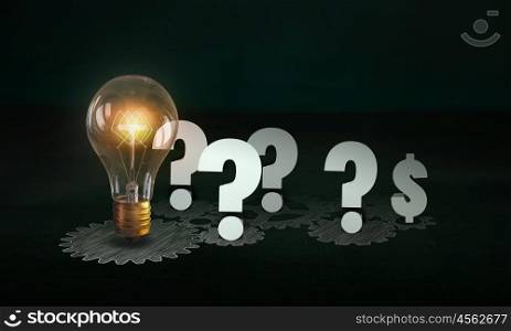 Producing energy. Glowing light bulb and gears mechanism on dark background