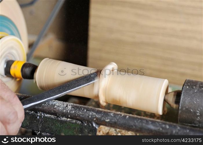 Product manufacturing wooden blank on the lathe