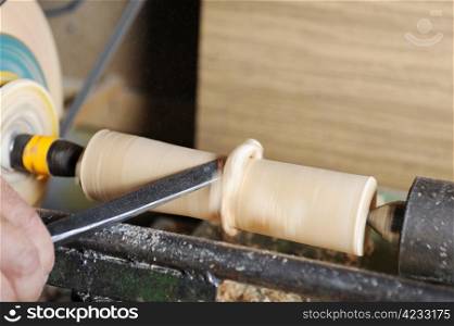 Product manufacturing wooden blank on the lathe