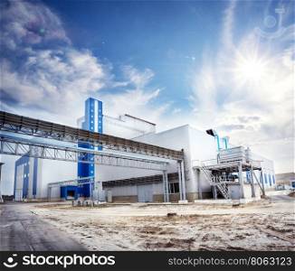 Production facilities at the plant under sunny skies. Production facilities at the plant
