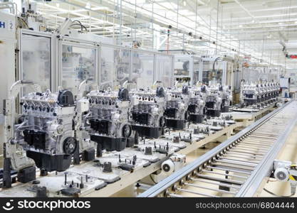 Production line for manufactoring of the engines in the car factory.