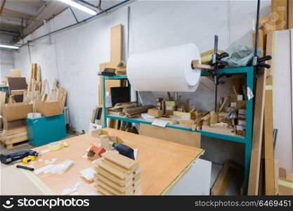 production, manufacture and woodworking industry concept - furniture factory packing shop. woodworking factory packing shop
