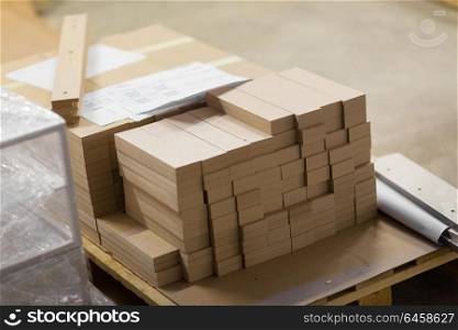production, manufacture and woodworking industry concept - wooden or medium density fibreboards at workshop. medium density fibreboards at woodworking plant