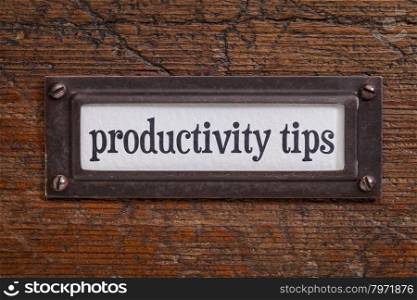 productivity tips - a label on a grunge wooden file cabinet