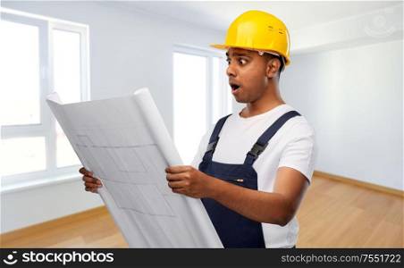 profession, construction and building concept - shocked indian builder or repairman in helmet with blueprint over empty room background. shocked indian builder in helmet with blueprint