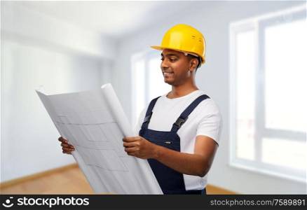 profession, construction and building - happy smiling indian builder in helmet with blueprint over empty room at new home or apartment background. happy indian builder in helmet with blueprint