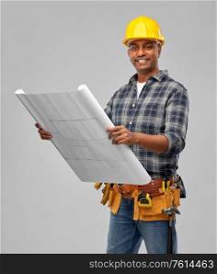 profession, construction and building - happy smiling indian builder in helmet with blueprint over grey background. happy indian builder in helmet with blueprint