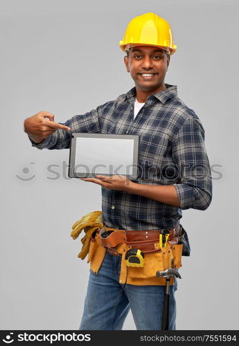 profession, construction and building - happy smiling indian worker or builder in helmet with tablet pc computer over grey background. happy indian builder in helmet with tablet pc