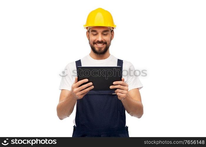 profession, construction and building - happy smiling male worker or builder in yellow helmet and overall with tablet pc computer over white background. happy male worker or builder with tablet computer