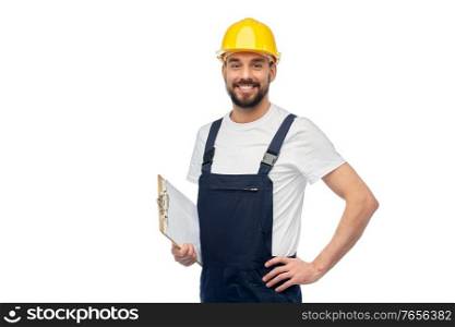 profession, construction and building - happy smiling male worker or builder in yellow helmet and overall with clipboard over white background. happy worker or builder in helmet with clipboard
