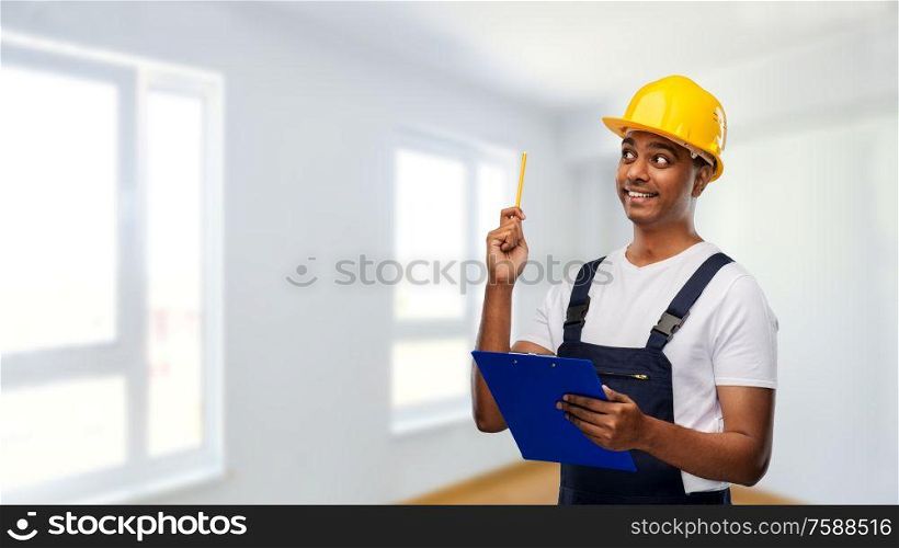 profession, construction and building - thinking indian worker or builder in helmet with clipboard and pencil having idea over empty room at new home or apartment background. builder with clipboard and pencil having idea