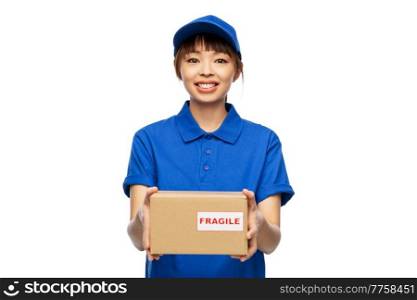 profession, job and people concept - happy smiling delivery woman in blue uniform holding parcel box over white background. happy smiling delivery woman holding parcel box